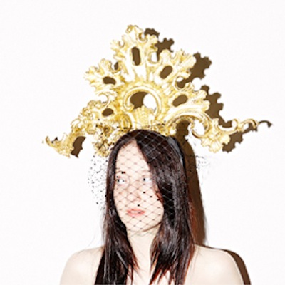 Anna Dello Russo hat by Piers Atkinson. Hand carved by Agrell Architectural Carving. "Dello" modelled by Andrea Riseborough